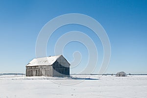 Old barn alone in the winter