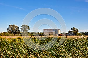 Old barn in a blue clear sky in countryside