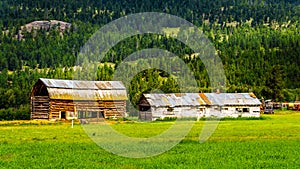 Old barn build from logs in a farmers field along the Coldwater Road between Hope and Merriit