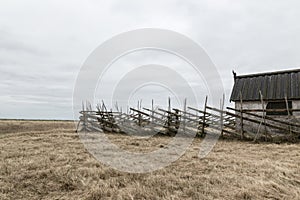 Old barn in the gloomy field