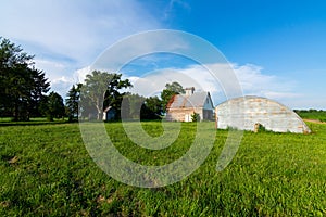 Old barn in grass field