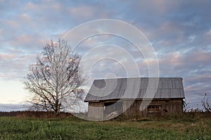 Old Barn House in the Autumn Sunset