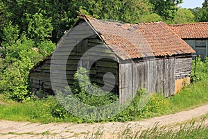 An old barn in the neighbourhood of the farm at the countryside.