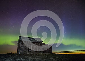 An old barn with northern lights