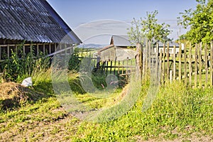 Old barn with old wooden fence in Snohy settlement in Polana mountains