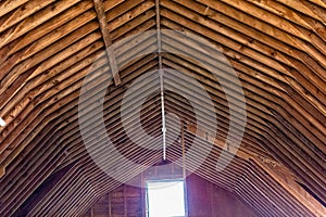 Old barn roof frame, rafters, being rehabilitated in a new development