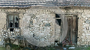 Old barn ruins. Ruins of abandoned farm building. Stone house in decay. Architecture and structure