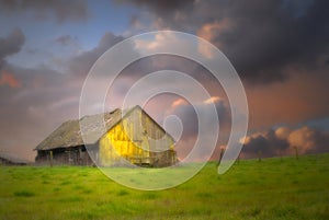 Old barn under dark skies with soft focus