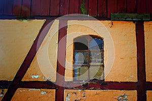 An old barn`s broken window Lolland Denmark photo