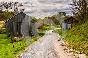 Old barns along a dirt road in rural York County, Pennsylvania.