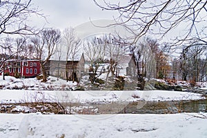 old barns and buildings viewed from the river
