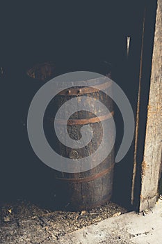 Old barrel on the floor of country barn