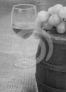 Old barrel with glass of wine