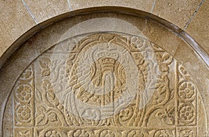 Old bas-relief on stone source Peloponnesus, Greece