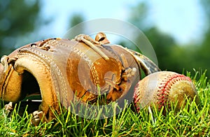 Old baseball glove and ball