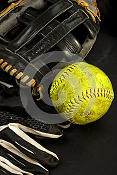 Old Baseball Glove with Yellow Softball and Batters Gloves