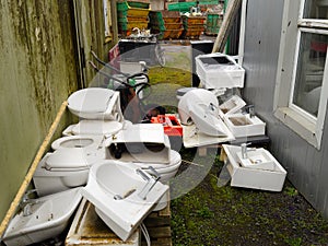 Old basins and toilet pans at scrap compound