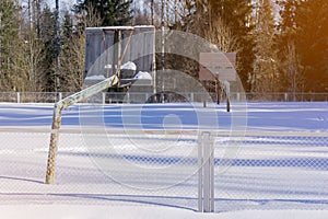 The old basketball court in the winter in the snow