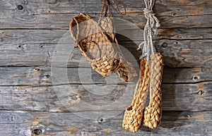 Old bast shoes. Lapti from birch bark. Vintage Russian national shoes