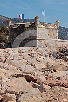 Old bastion and rocky shore. Menton, France