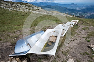 Old bathtubs used to water animals