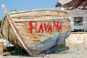 Old battered boat on the beach