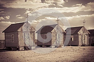 Old beach huts, retro sepia toned image