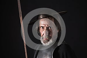 Old bearded warrior with breastplate and helmet photo