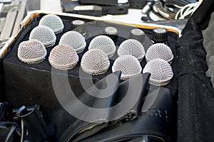 Old beat up mics placed in a traveling box