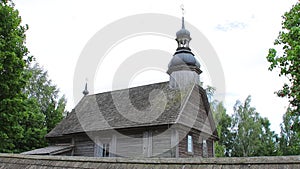 An old beautiful church in a log village. Object of architecture in the village, belief in God of villagers, historical