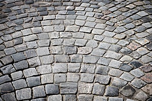 Old cobblestone road in city of Europe