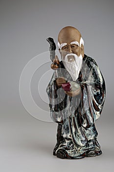 An old beautiful statue depicting a wise Chinese