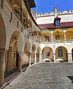 Old beautiful yard. House with columns on a sunny day. Architecture of the old city. Bratislava