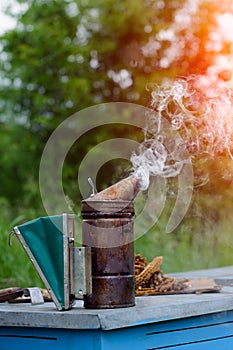 Old bee smoker. Beekeeping tool. Apiary. Beekeeping.