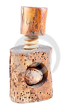Old beech wood nutcracker with walnut isolated