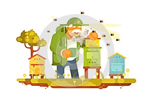 Old beekeeper in bee-garden