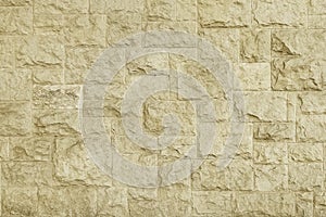 Old beige granite stone wall texture background