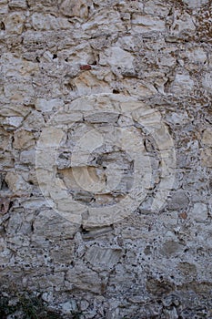 Old beige and gray stone wall blocks for background