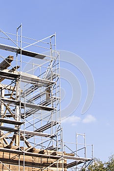 The old bell tower. Restoration of the old bell tower. Scaffolding