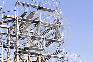 The old bell tower. Restoration of the old bell tower. Scaffolding