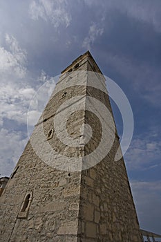 Old bell tower of stone church