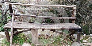 Old bench in autumn in a forest