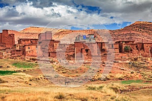 Old berber architecture in High Atlas Mountains region in Morocco. Houses of clay at the foot of the mountains.