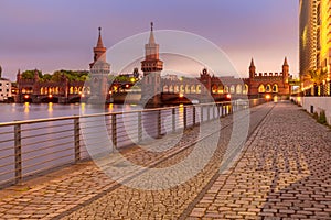Old Berlin Oberbaum Bridge over the Spree River at sunset.