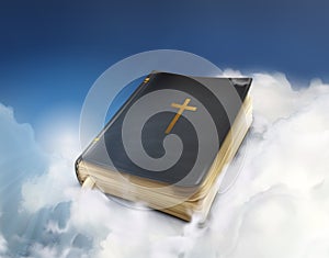 Old Bible book in the clouds