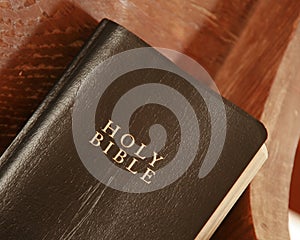 Old Bible in a church pew photo