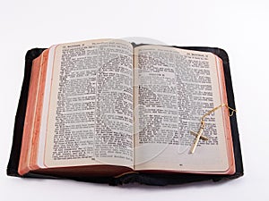 Old Bible with gold cross photo