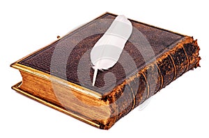Old Bible in leather cover on white