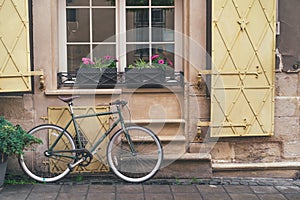 Old bicycle stands under the windows of the hotel in downtown Lviv