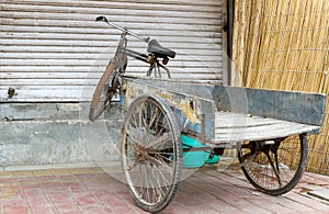 Old bicycle with trailer in Delhi, India